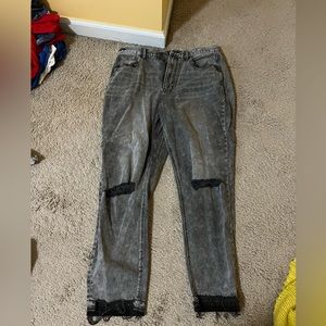 American Eagle jeans size 12.  Holes with darker denim around ankles